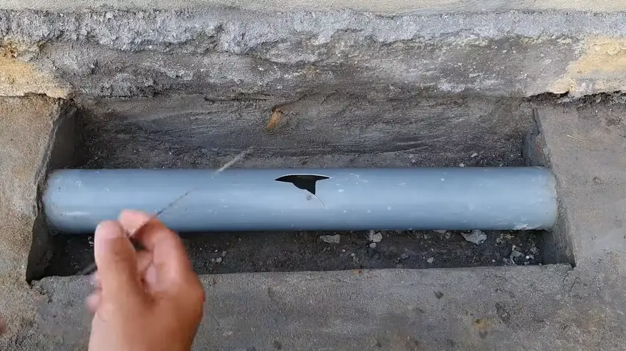 plumber checking a residential manifold in a Parker basement utility room