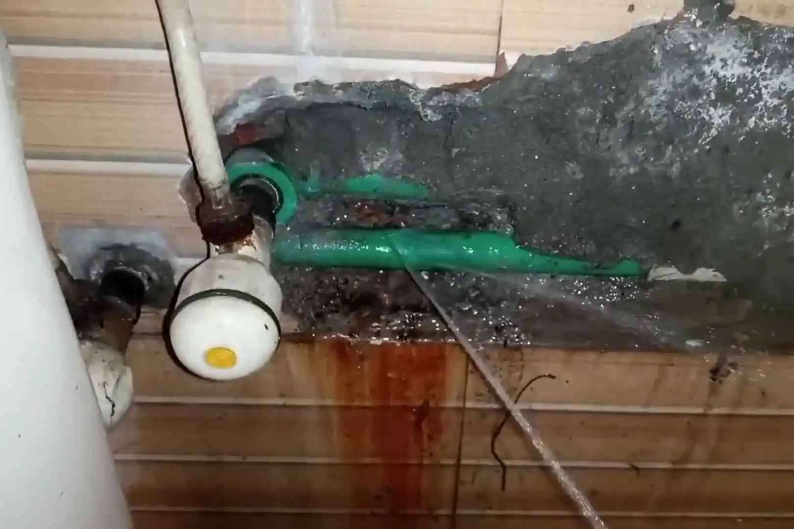 PVC drain elbow joint with visible glue failure in a Cottonwood Parker basement