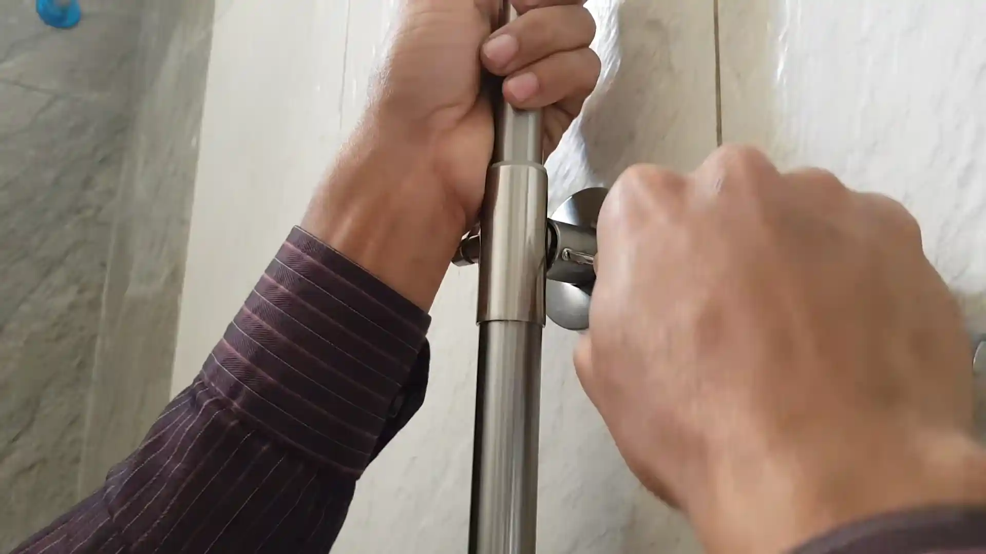 shower pan inspection with moisture meter in a Hidden River master bathroom