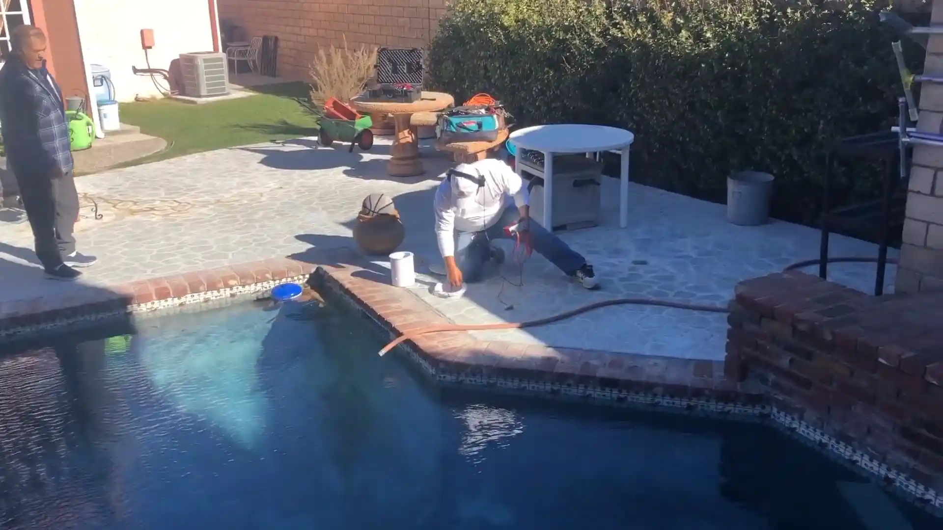 built-in pool spa jet body inspection in a Stonegate backyard