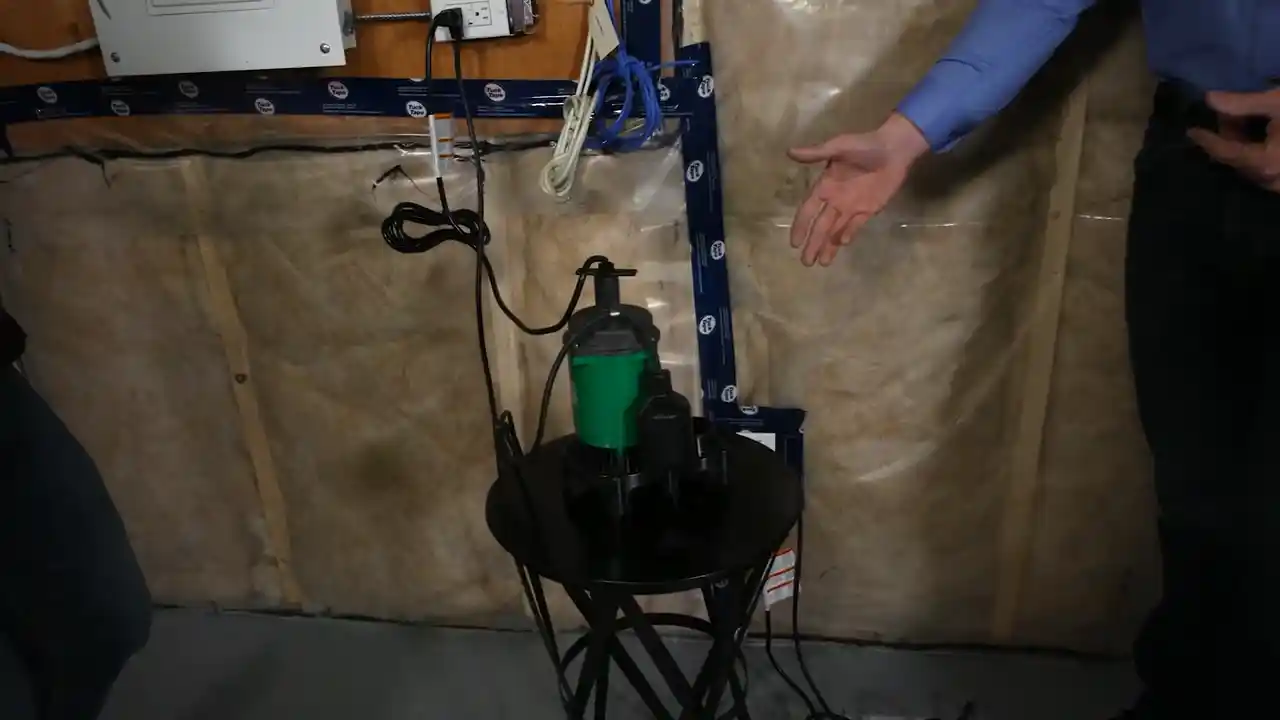 sump pit inspection with submersible pump and discharge piping in a Lincoln Creek basement