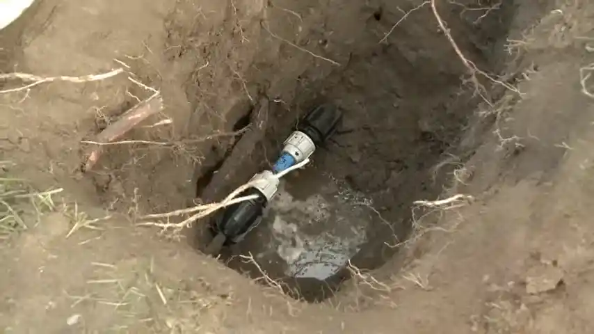 technician using a ground microphone on a large Reata Ridge lot